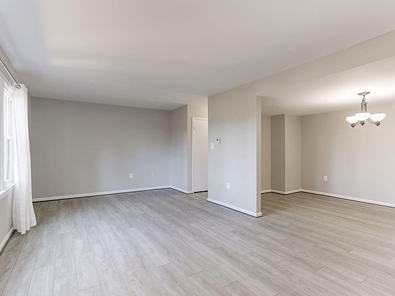 Large LR with beautiful LVP flooring looking toward DR.