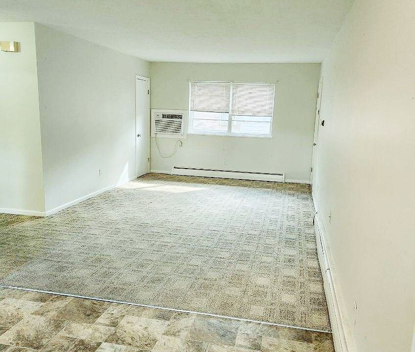 Living area with coat closet and view of court yard