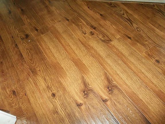 Beautiful Hand-Scraped-Wood-Look Laminate Flooring in Several Rooms - Other Rooms Have Tile - No Carpet