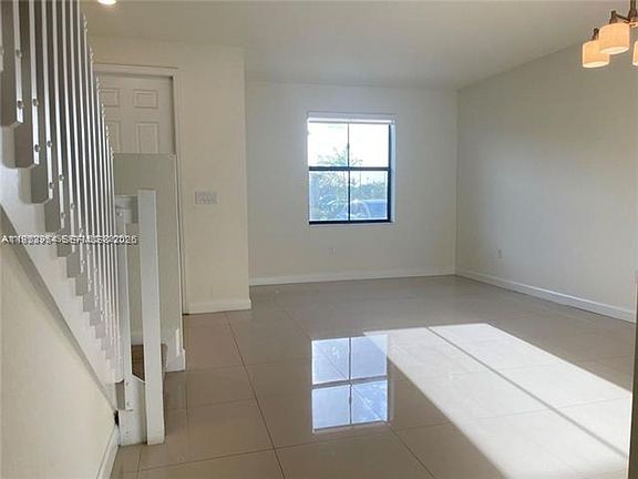 2nd image of 10491 W 34th Ct #Townhouse 10491