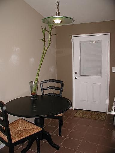 Blinds between double paned window on door, tile, beautiful light fixtures