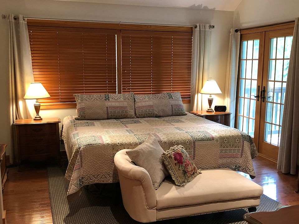 Master bedroom with king-size bed. French doors to balcony. Window treatments included. Cathedral ceilings, two skylights with shades. Remote controlled overhead light and ceiling fan.