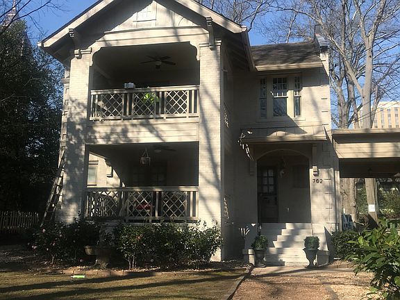 This cozy cottage sits behind this historic home on one the most charming streets in midtown.