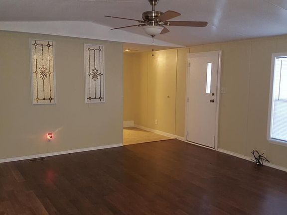 Family room, open floor plan with laminate flooring.
