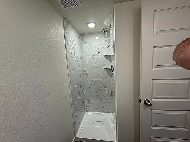Remodeled Unit - Marble Surround Shower