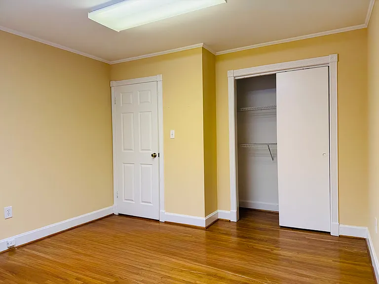 Each room in this space comes with its own closet, blending warm, inviting tones with functional storage to keep the area organized and clutter-free.