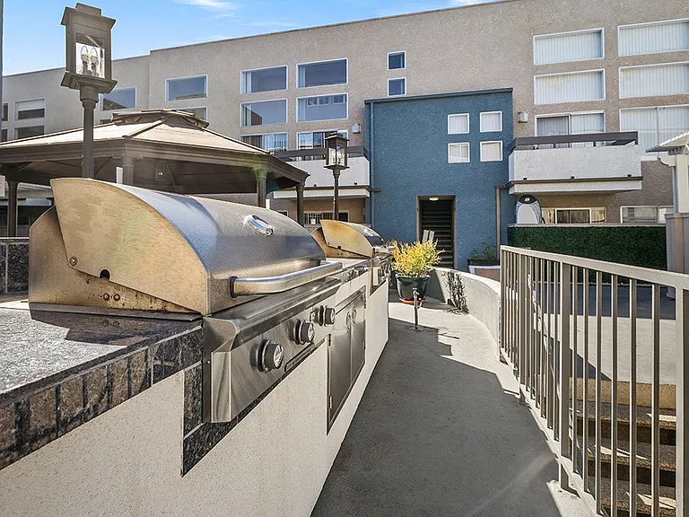 Courtyard BBQ and cooking area near large seating space