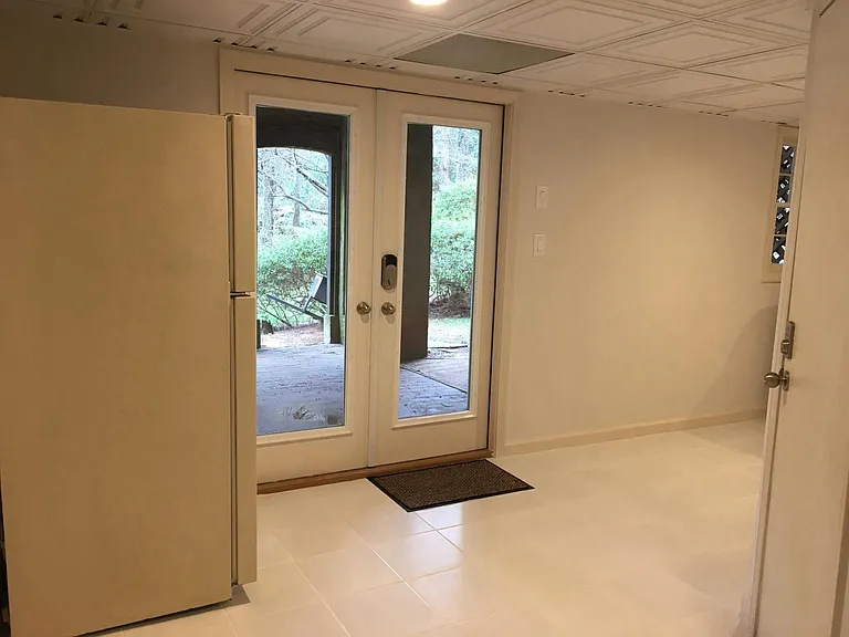 Laundry room with pool access and beer fridge