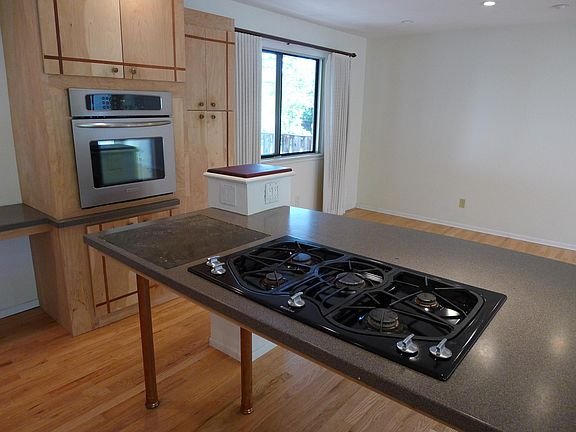 Kitchen with cooktop looking toward dining area
