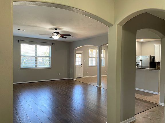 Open living room to kitchen and dining area