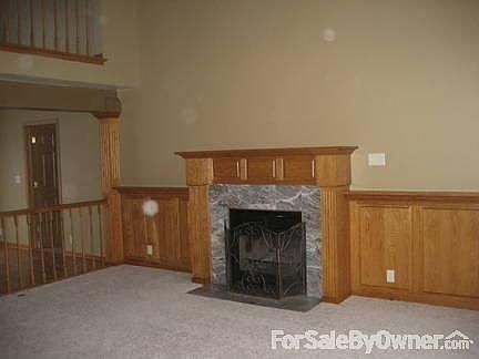 Fireplace (wood burning)
						:
						Marble surround with oak mantle above fireplace and along entire wall