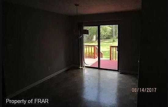 Dining room, leads out to a deck, and huge fenced back yare