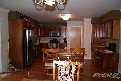 dining area to kitchen with old door