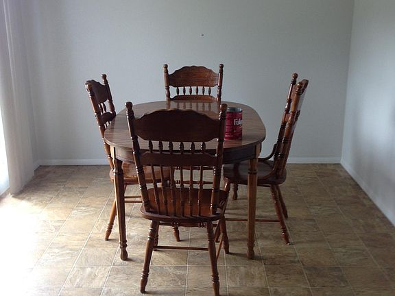 Large Dining area with sliding doors to fenced back yard - nice grass area and mature trees