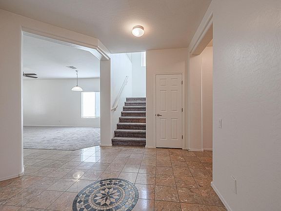 Hallway Facing Stairs and Dining