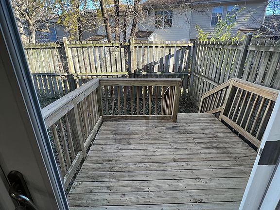 back deck with fenced in yard off the dining room