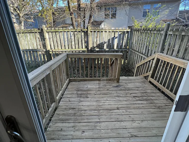 back deck with fenced in yard off the dining room