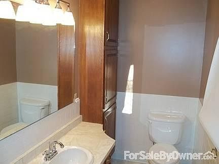 Main Bathroom
						:
						Fresh, neutral paint on the walls accent the white wall tiles.