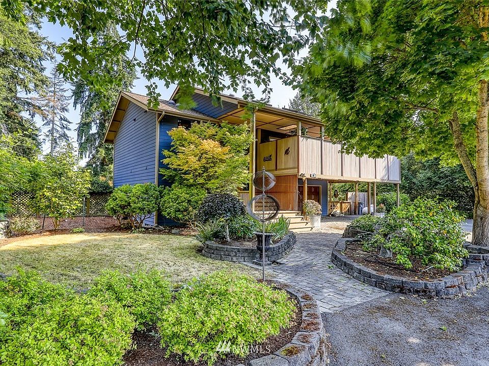 Tucked away on the back of the lot, this home is surrounded by magical landscape.