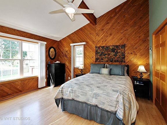 Spacious Master Bedroom on main level has vaulted ceilings, large closet and patio doors leading to 