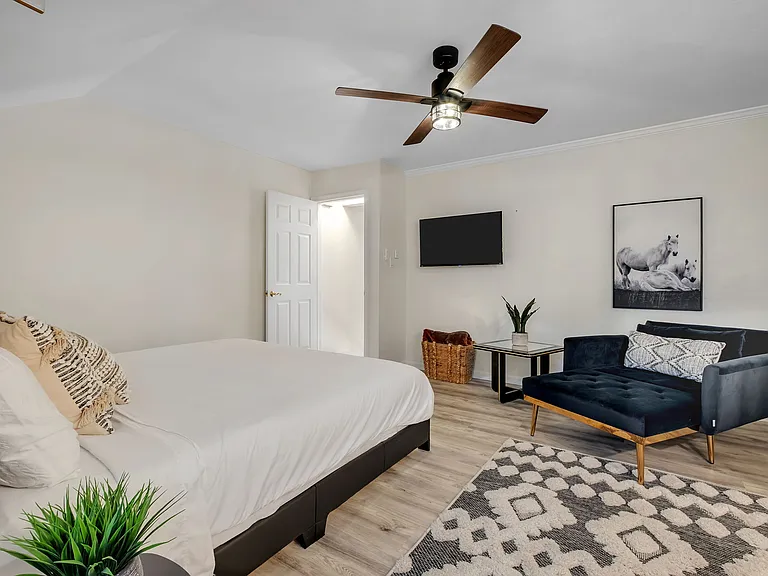 Upstairs master with convertible twin chaise and TV