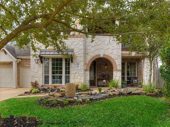 Decking in attic above the garage allows for additional storage.