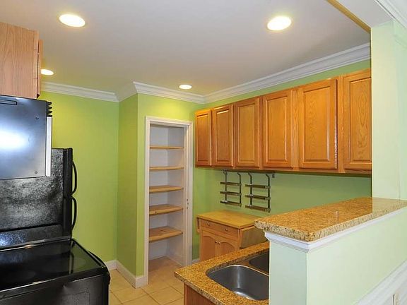 Updated kitchen with newer stainless range/microwave.