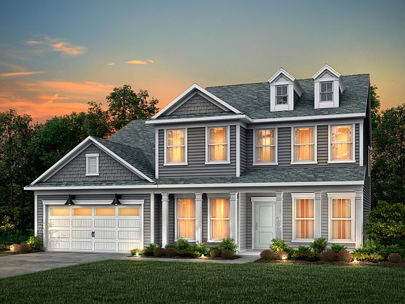 Riverton Exterior 54 features siding, shakes, large covered front sitting porch and 2 car garage