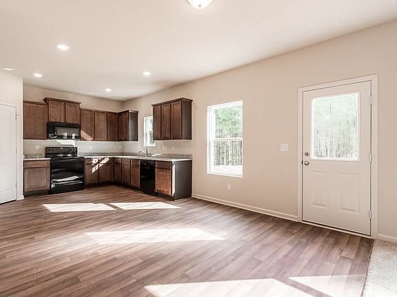 A chef-ready kitchen overlooks the grand entertainment space