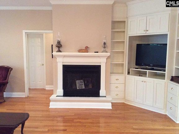The fireplace has gas logs and built-ins for entertainment center.