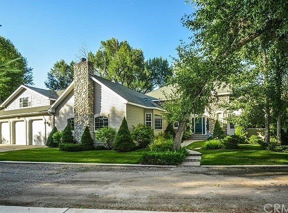 View of front home w/completely private road and driveway that no one else is allowed to drive on!