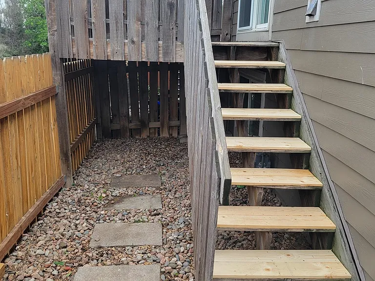 Fenced back yard with deck