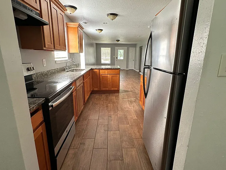 Laundry room located at rear of kitchen