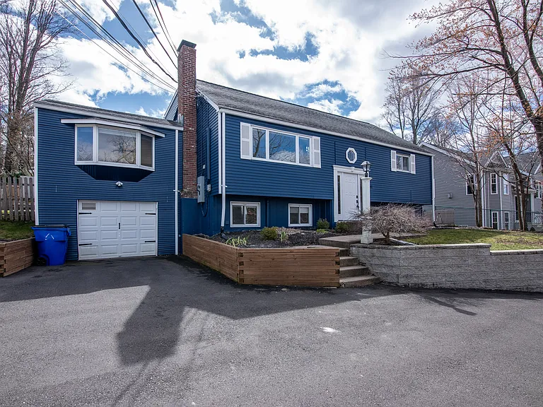 1 car garage with ample parking for other cars in driveway