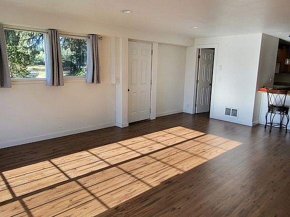 Living/sitting room. Main entrance on the left.