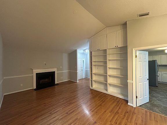 Fireplace and built in bookshelves in living room