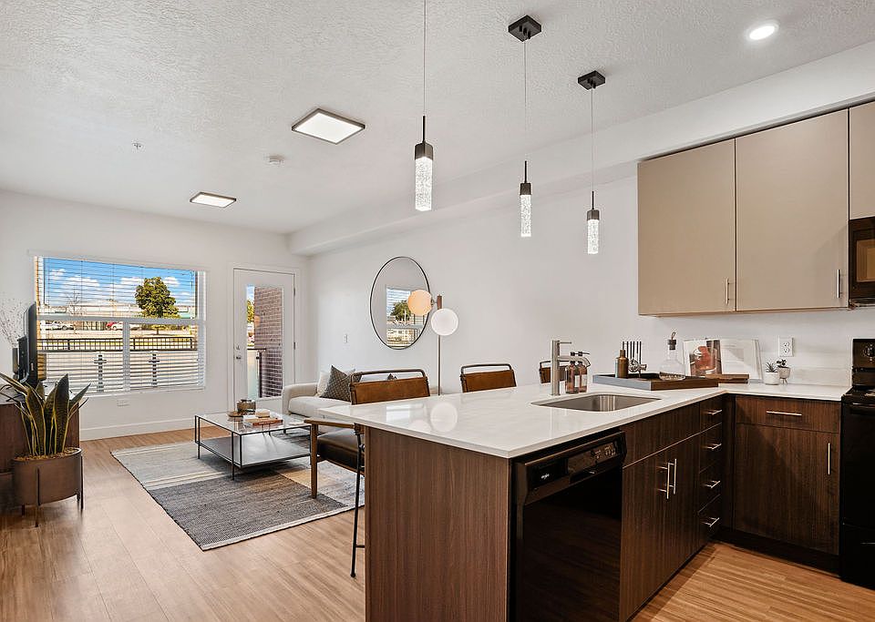 From cooking to relaxing, the kitchen and living area seamlessly blend together to create a welcoming space for gathering, entertaining, and enjoying daily life.