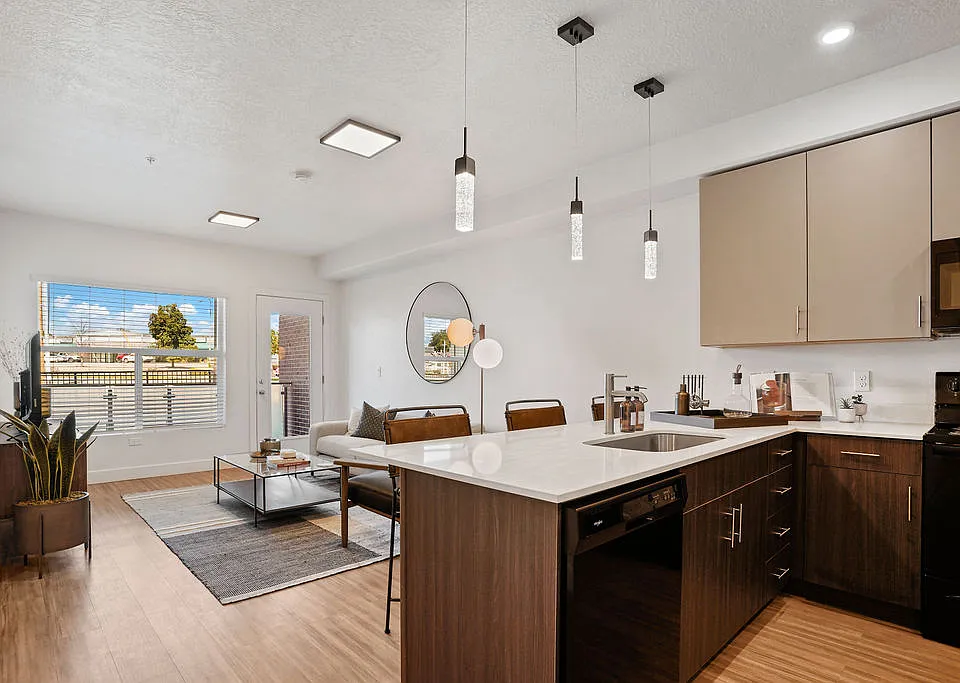 From cooking to relaxing, the kitchen and living area seamlessly blend together to create a welcoming space for gathering, entertaining, and enjoying daily life.