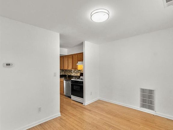 Separate dining area with lots of light, beautiful floors!