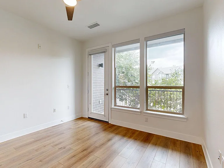 Apartment Living Room with wood-style flooring, and Patio/Balcony.