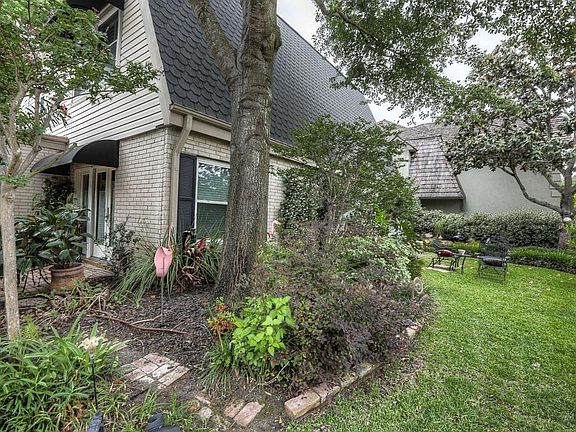 This view of the front yard shows the depth of the yard and gives your a peak at one of several outd
