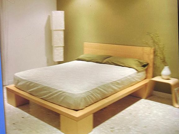 Master bedroom with large closet and queen size bed and vanity area