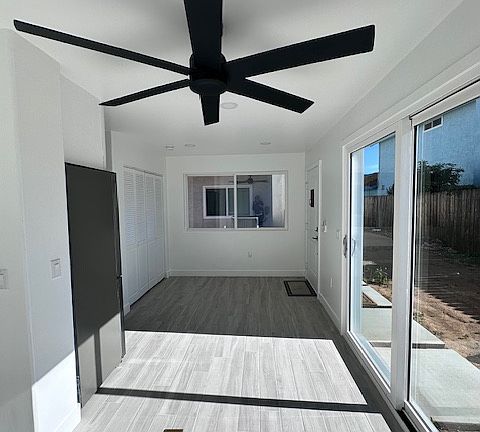 Living Room with Closet Space and Large Sliding doors.