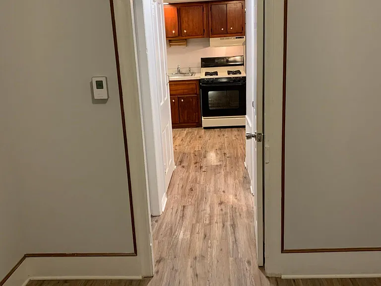 Well-lit walkway: living room to kitchen