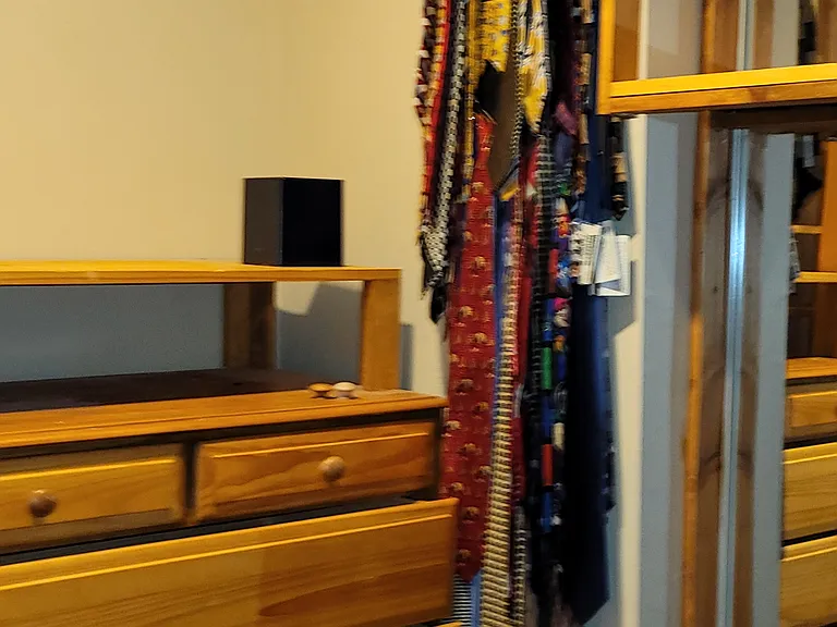 His side of walk in closet includes permanent chest of draws many bars and cubbies