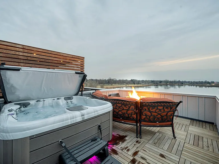 If you're not into soaking in the customizable hot tub, stay dry next to the toasty fire table on the comfy circular couch and take in the views. Even on gloomy days the view is still spectacular! Extra camp chairs are available to add extra seating.
