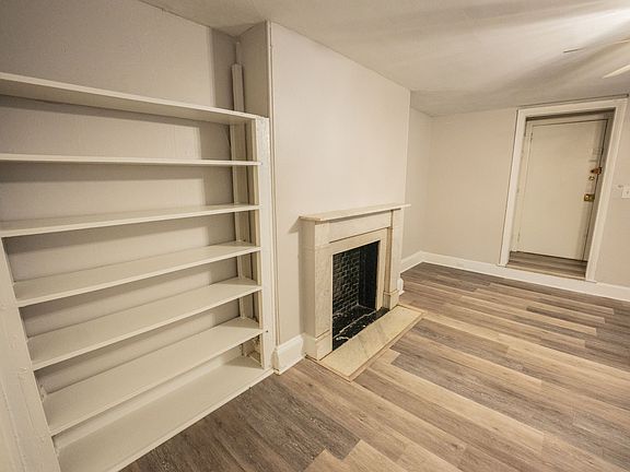 Studio with Fireplace and Built-In Shelving