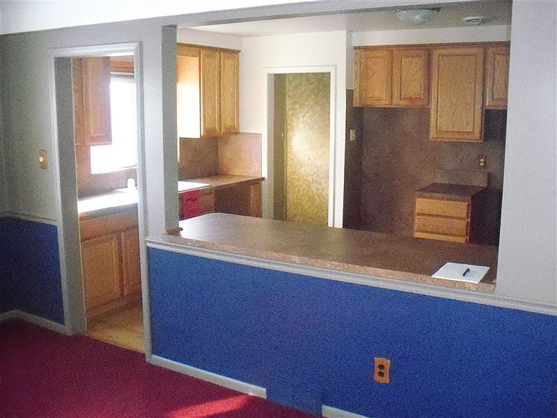 Kitchen from dining room, before new paint