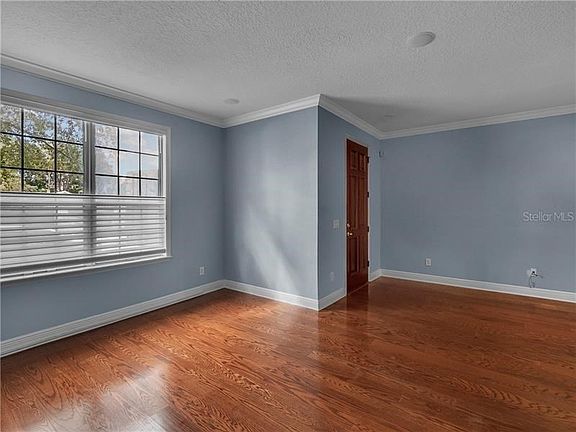 Living room with Hunter Douglas blinds.