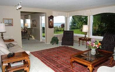 Living room and den area, looking northwest over Bellingham Bay